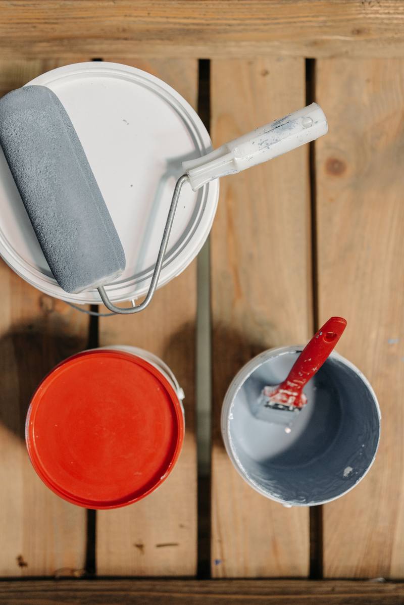 Paint tins and brushes ready for decorating